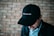 close-up photography of black fitted cap