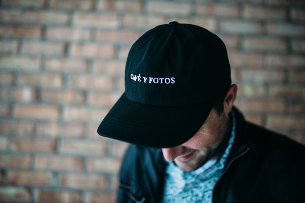 close-up photography of black fitted cap