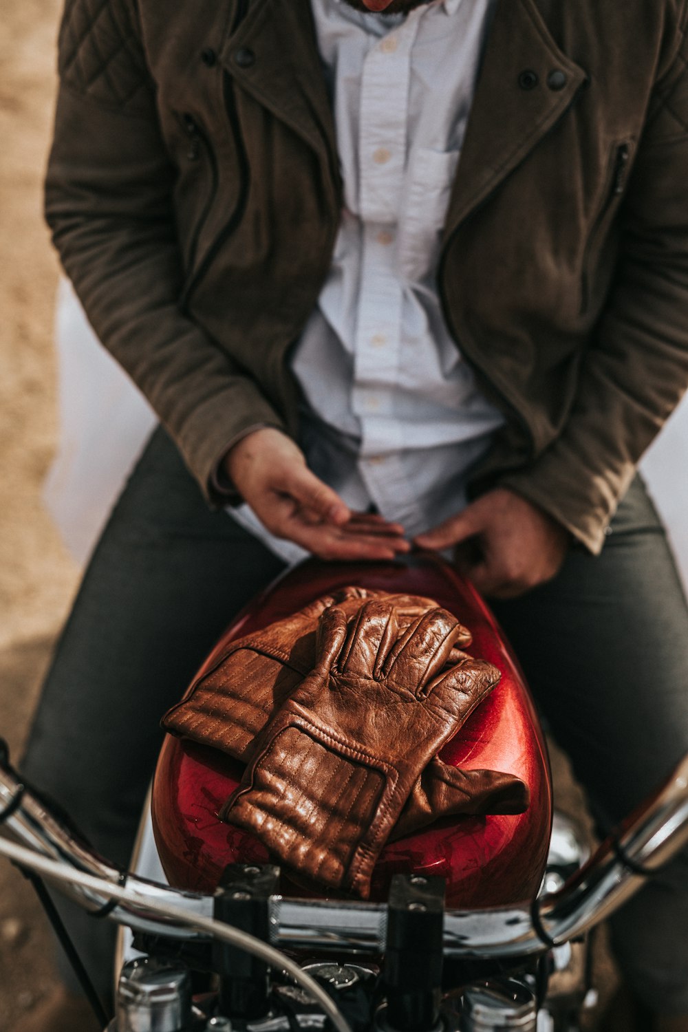 man riding on red motorcycle