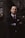 man wearing black notched lapel suit jacket in focus photography