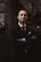 man wearing black notched lapel suit jacket in focus photography