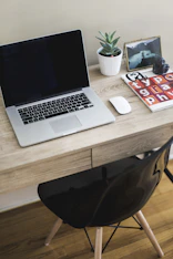 MacBook Pro on table with Magic Mouse