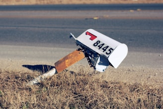 white mailbox on road at daytime