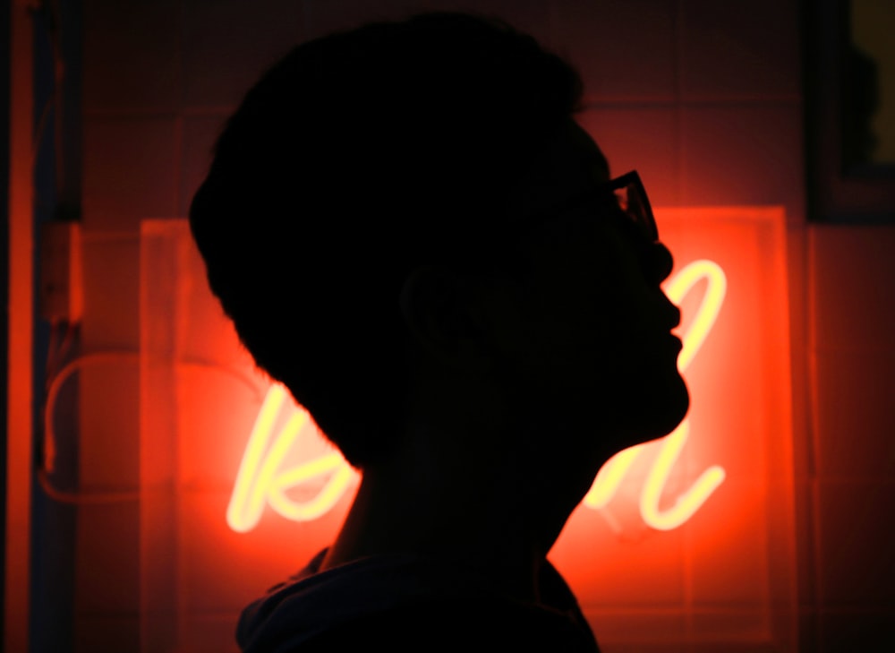 silhouette photo of man wearing sunglasses