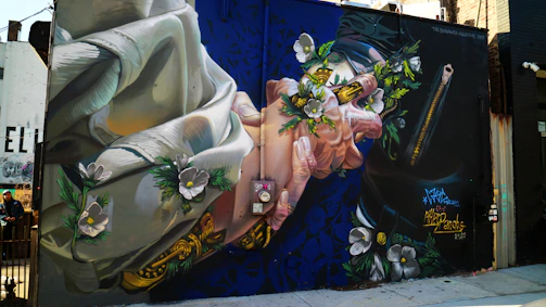 A vibrant community mural depicting hands joined in unity and peace.