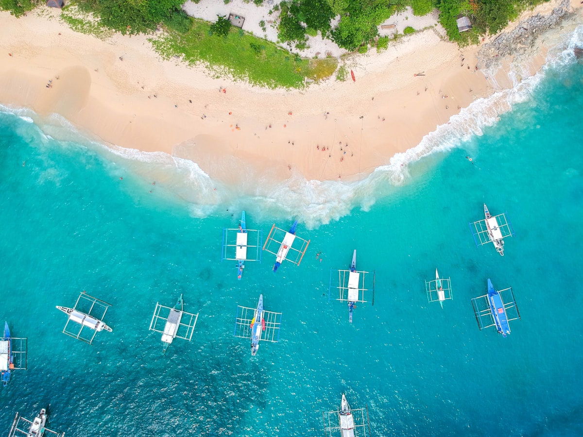 Palawan May — aerial view of boats near Helicopter Island in El Nido at the edge of the rainy season