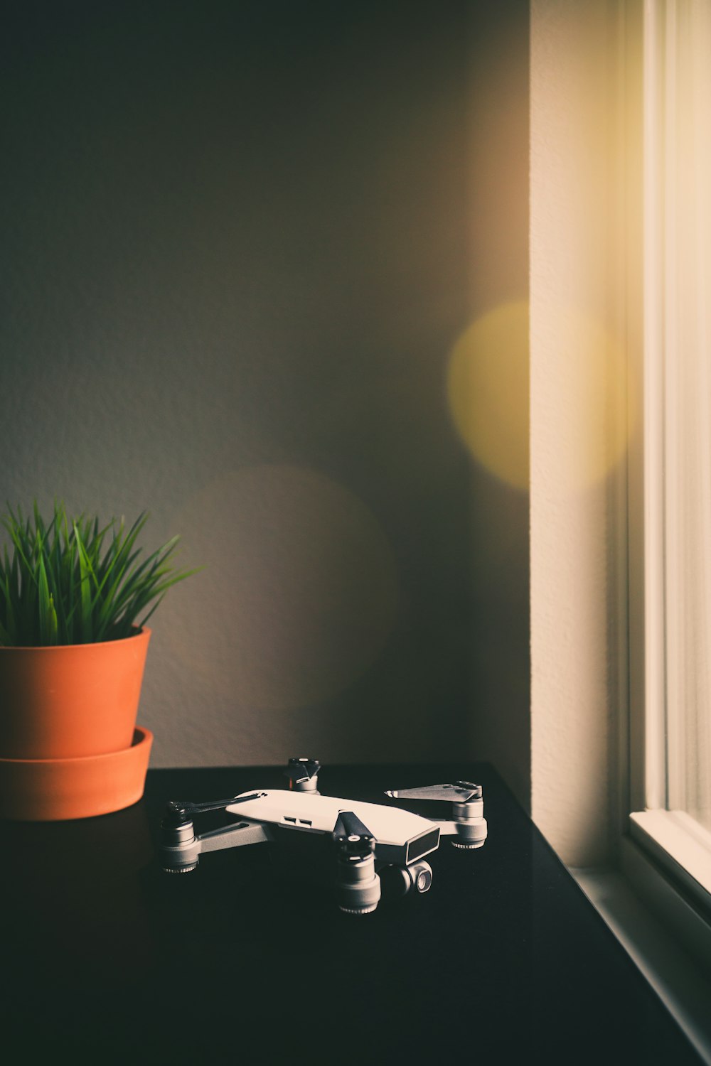 white and black DJI Mavic drone on table