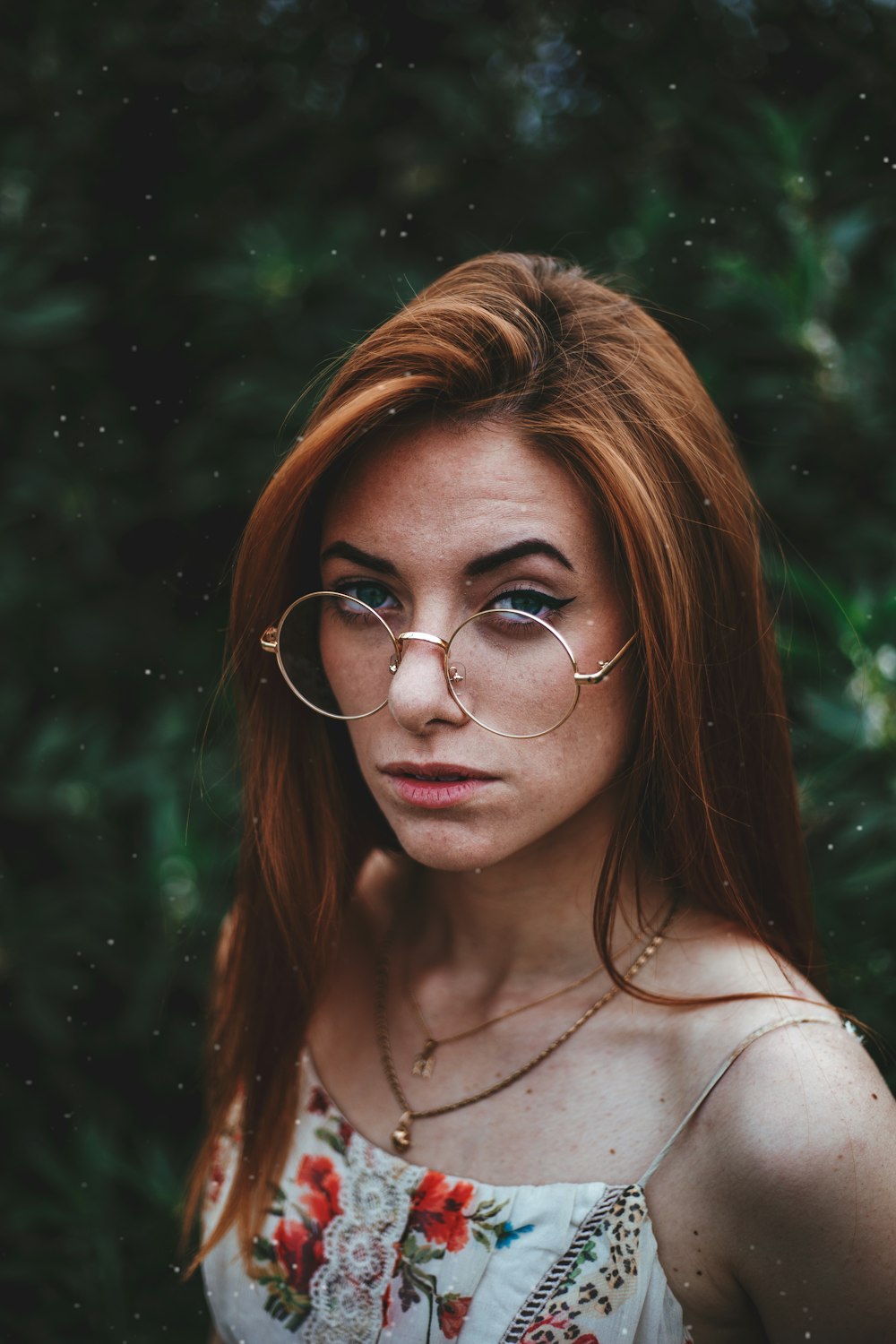 woman standing near green tree