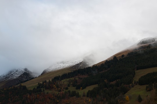 white snow covered mountain during daytime in Bulle Switzerland