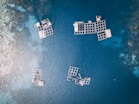 aerial photography of white frames on top of water