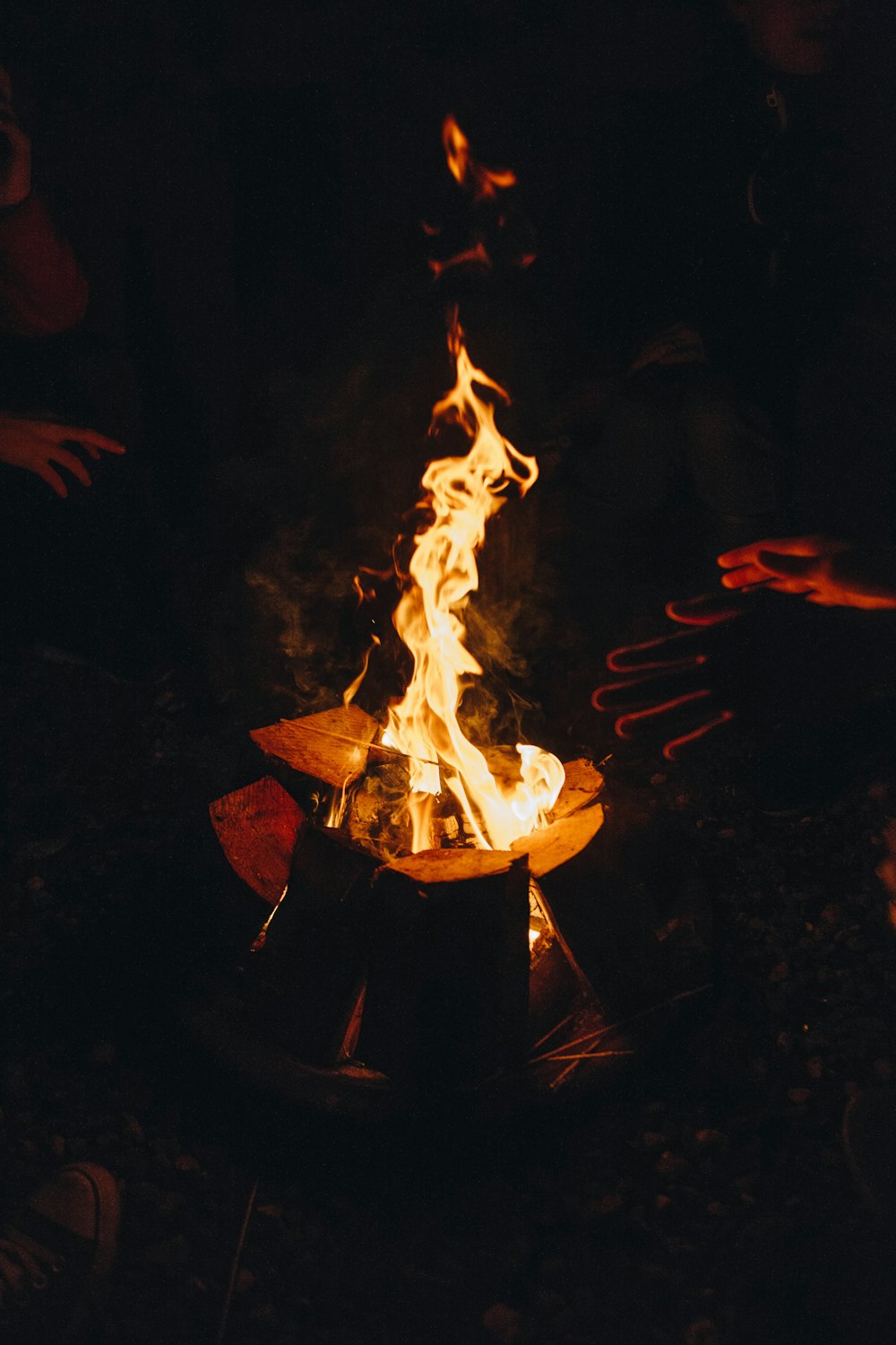 two people near bonfire