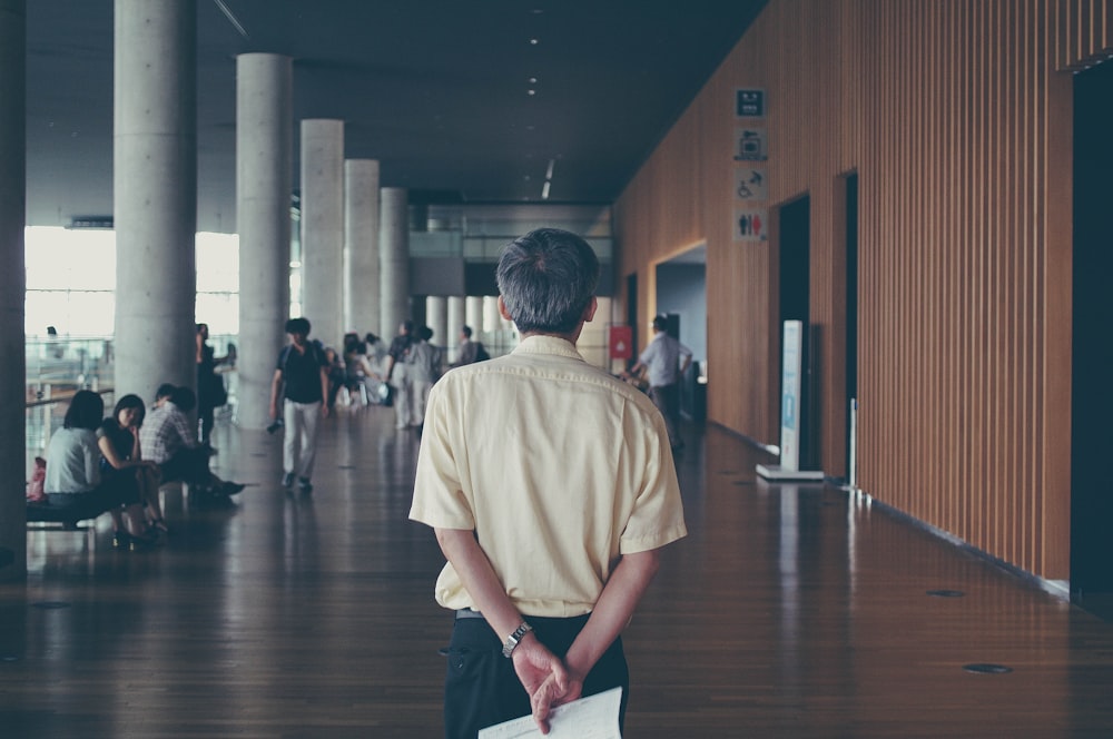 man walking near people