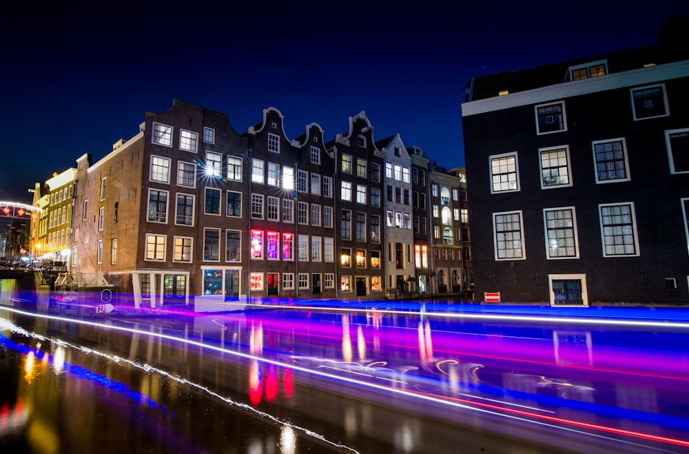 time-lapse photography of busy road and classic establishment