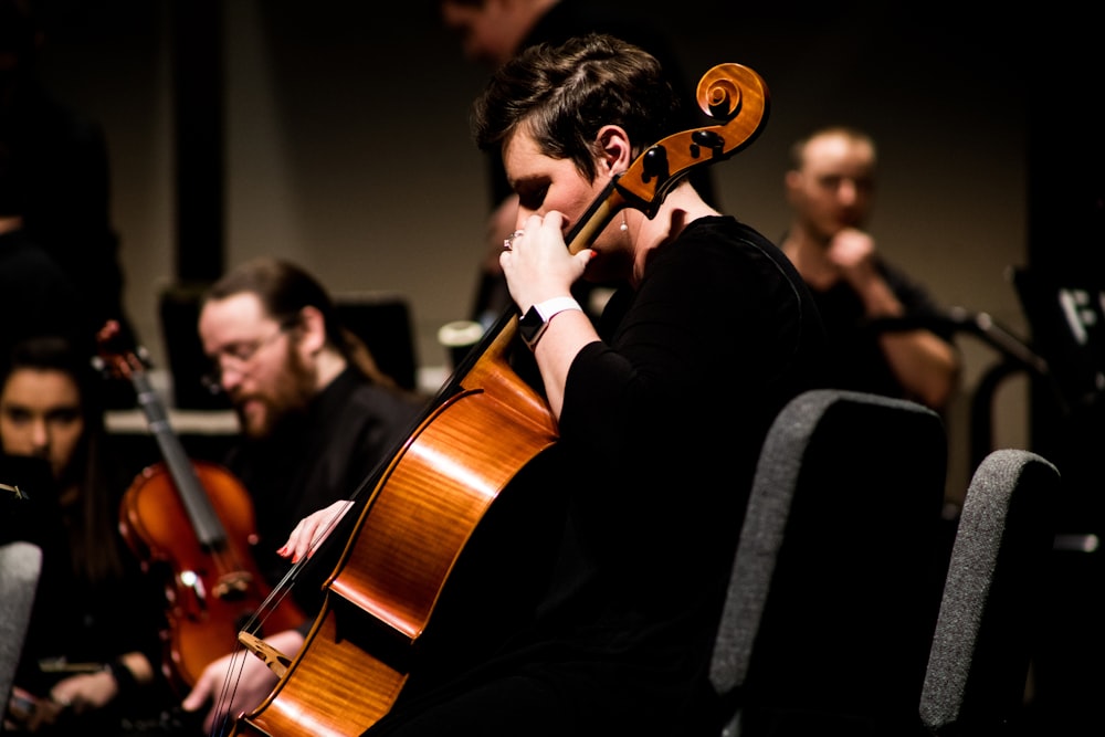 person playing stringed instrument