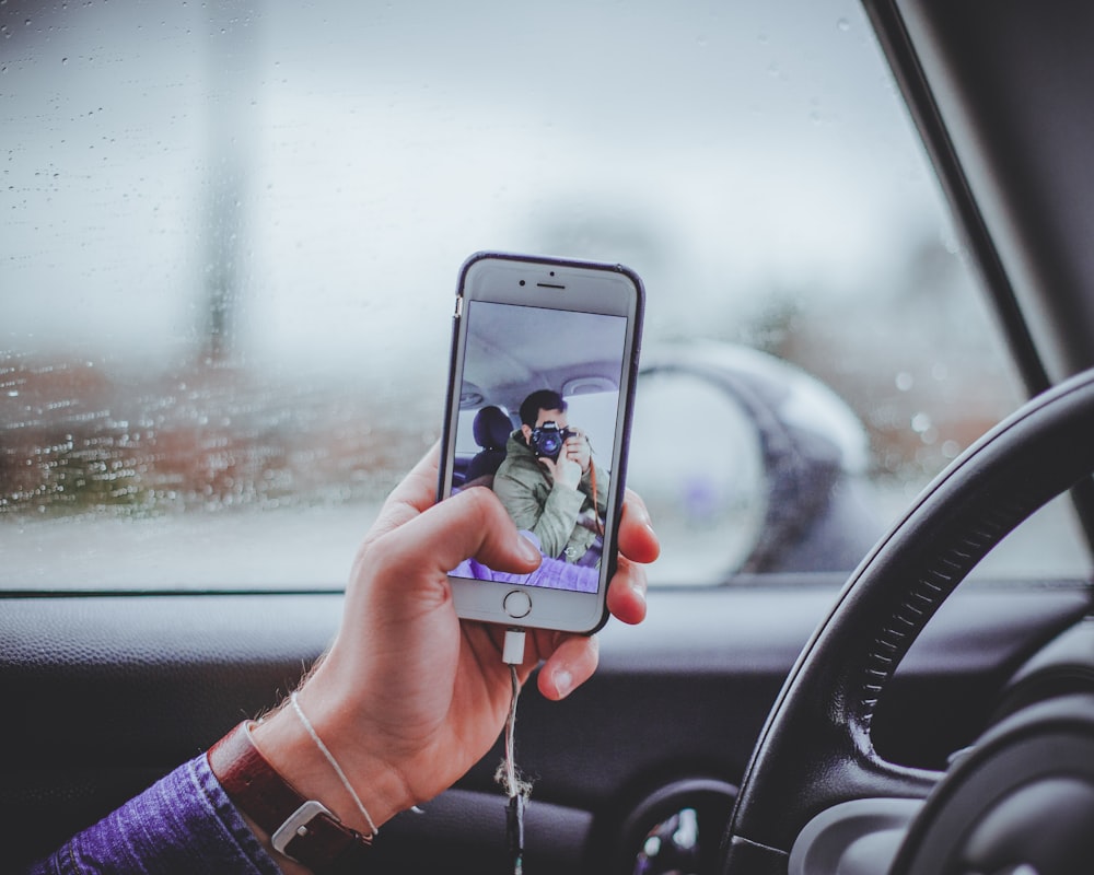 person taking selfie inside the car