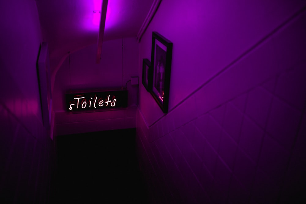 purple Toilet signage downstairs