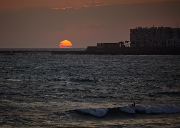 A vibrant sunset over Bali's famous surf beaches.