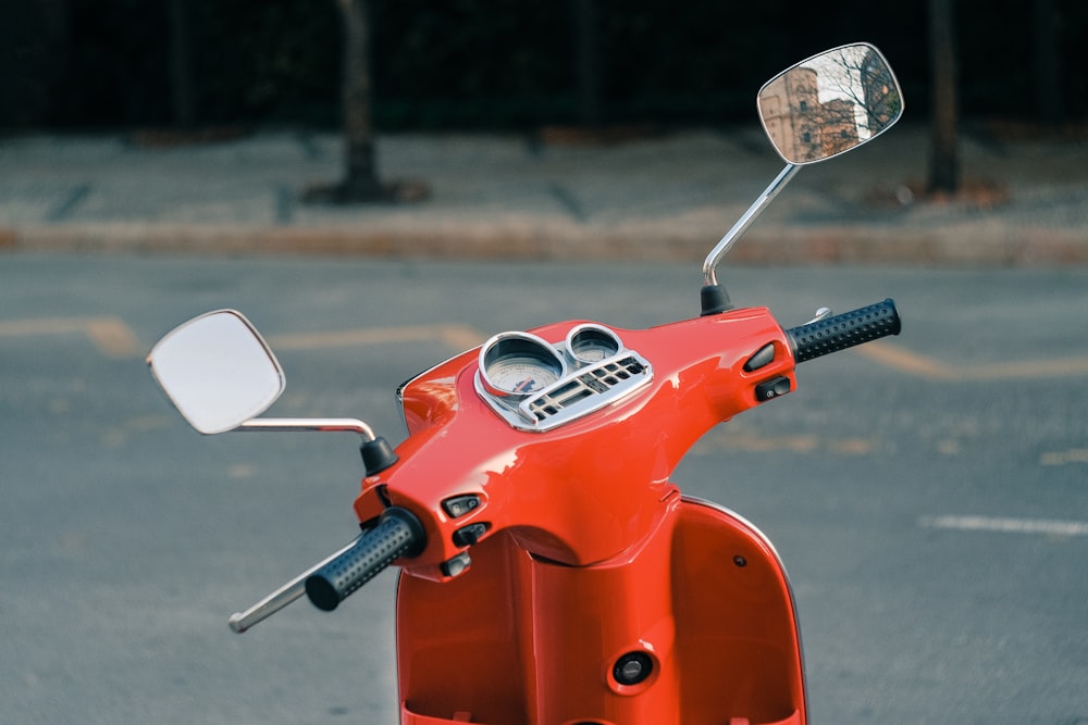 selective focus photography of parked motor scooter