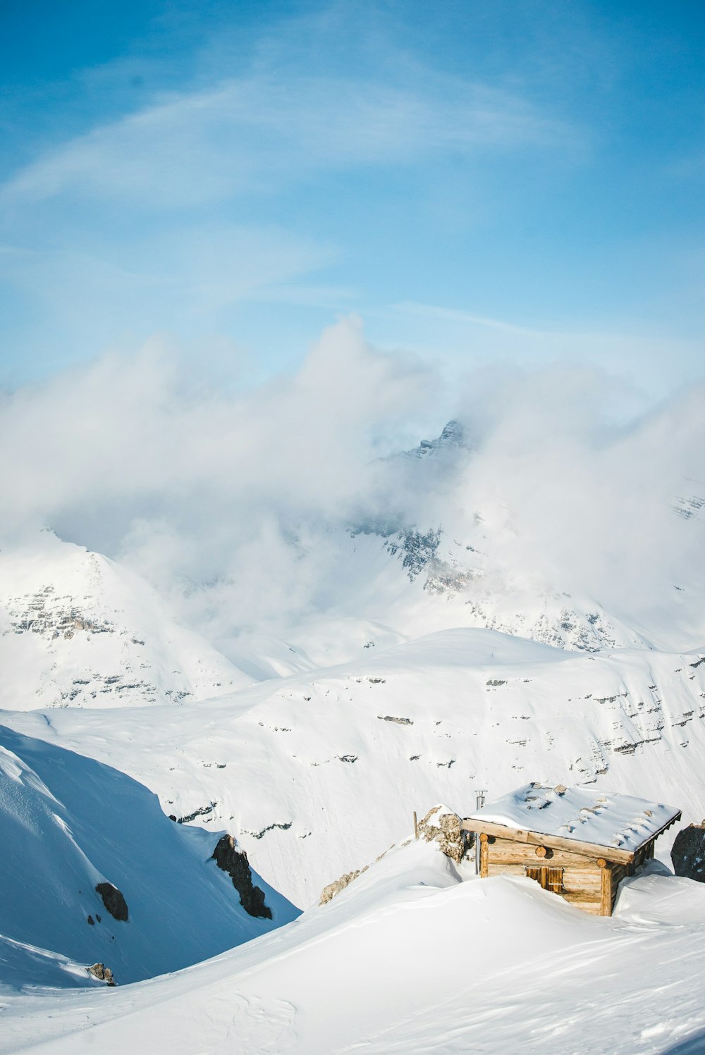 sunlight over snow covered mountain