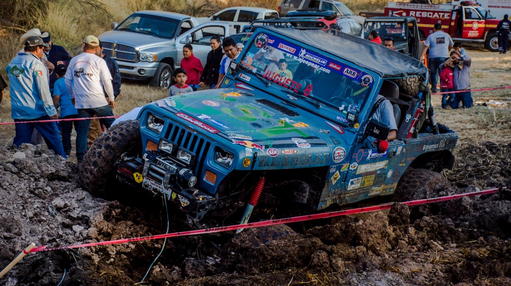 blue Jeep Wrangler on off road track