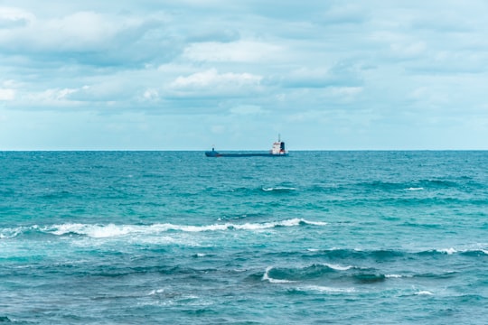 black ship on body of water in Santander Spain