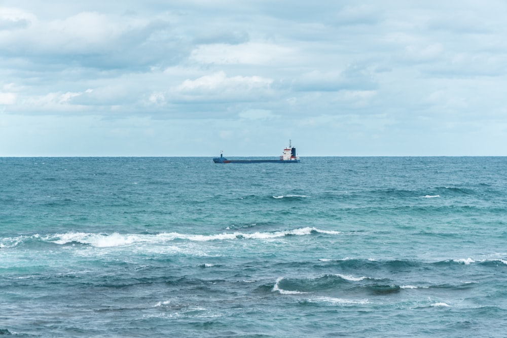 black ship on body of water