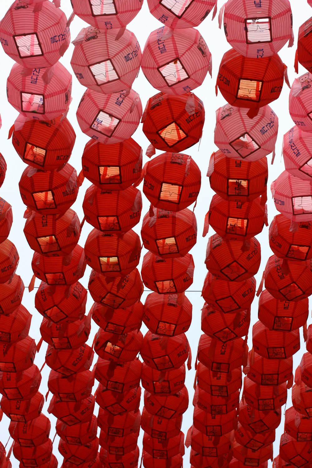 red paper lantern lot during daytime