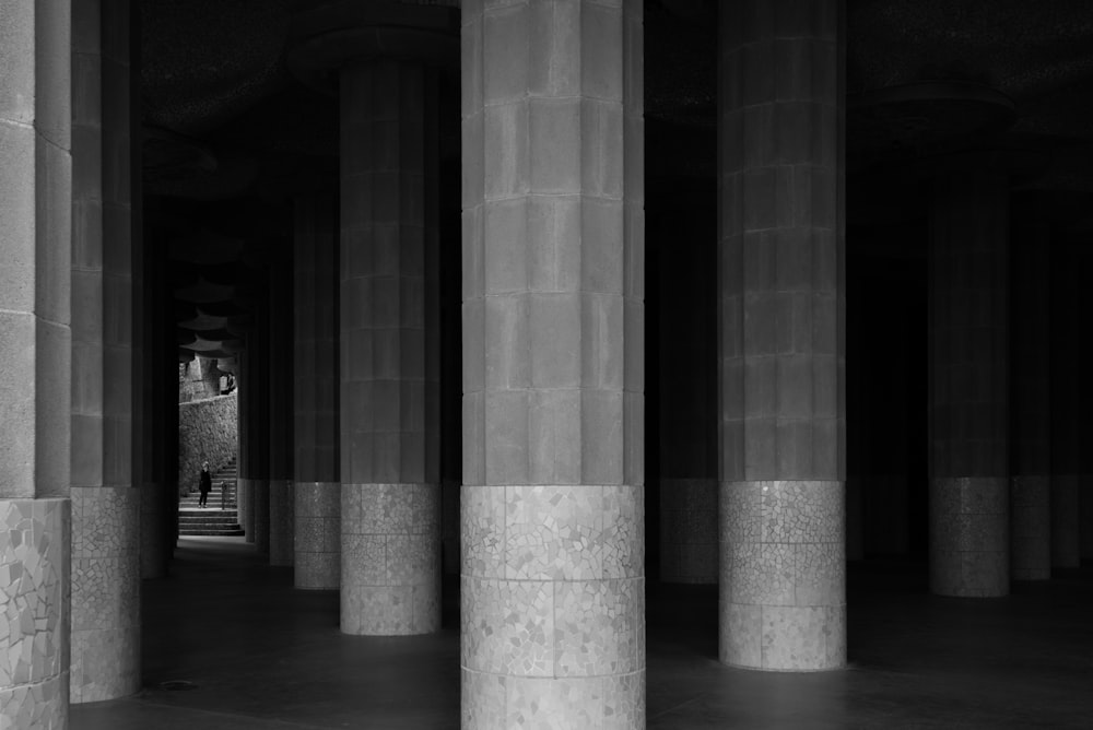 grayscale photo of support pillars