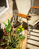 Wooden flower pots arranged on a rustic wooden table outdoors