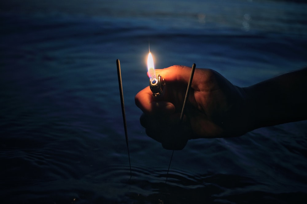 person lighting incense