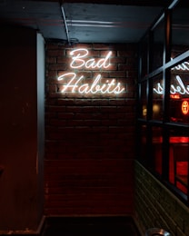 white bad habits LED signage