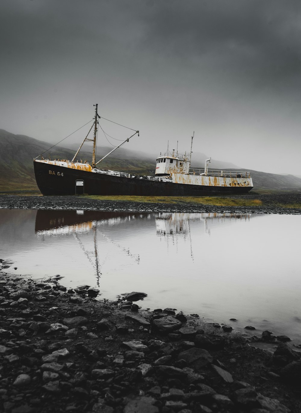 black and white DS 64 cargo ship on field