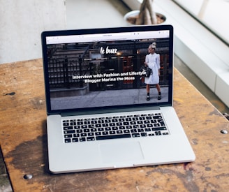 MacBook Pro on brown wooden table