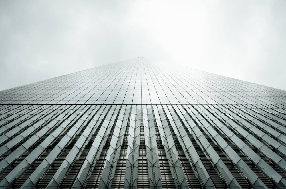 shallow focus photography of curtain wall building at daytime