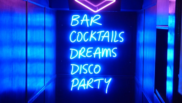 neon sign reading bar cocktails dreams disco party, the nightlife, rstour