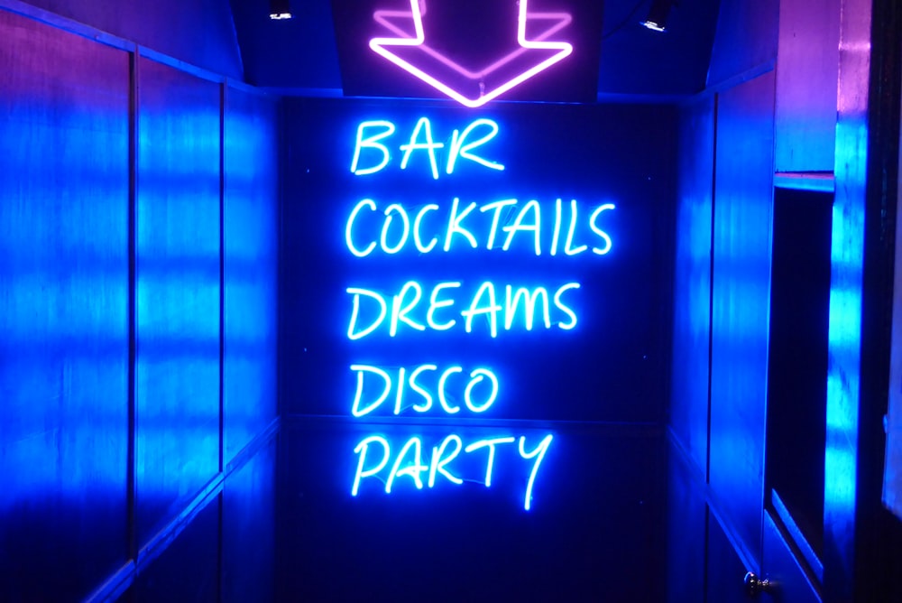 neon sign reading bar cocktails dreams disco party