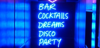neon sign reading bar cocktails dreams disco party