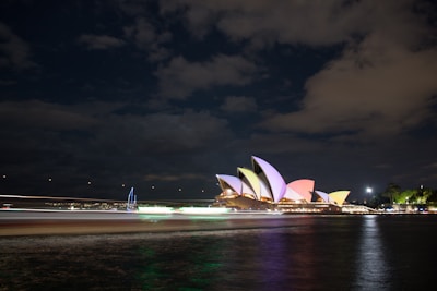 Digital artwork of the Sydney Opera House glowing at sunset.
