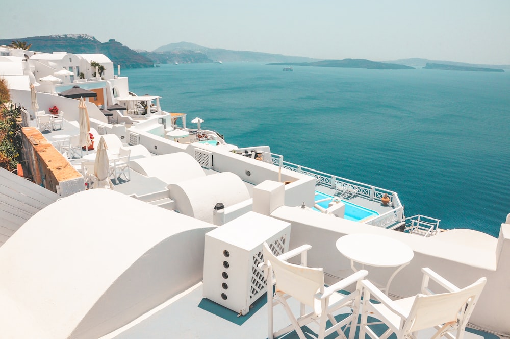 photography of concrete buildings near the body of water