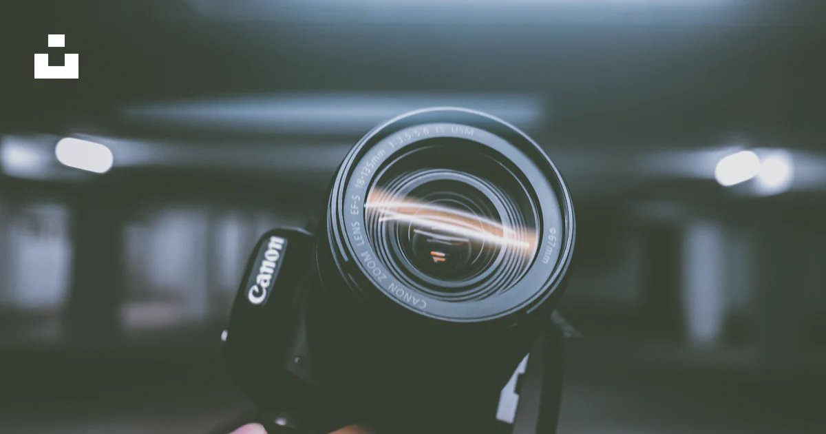 Camera Photo Inside Person holding black Canon DSLR camera inside indoor vehicle garage ...