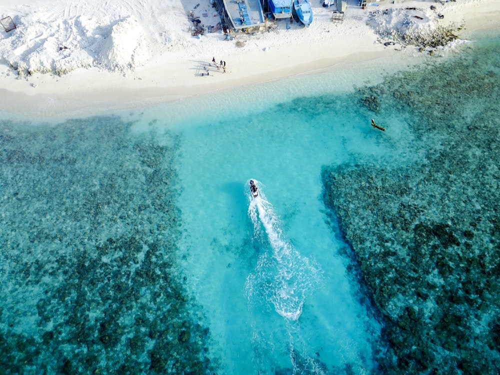 aerial photography of boat on ocean during daytime