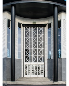 A sleek, modern corporate building entrance with black and gold accents symbolizing security and professionalism.