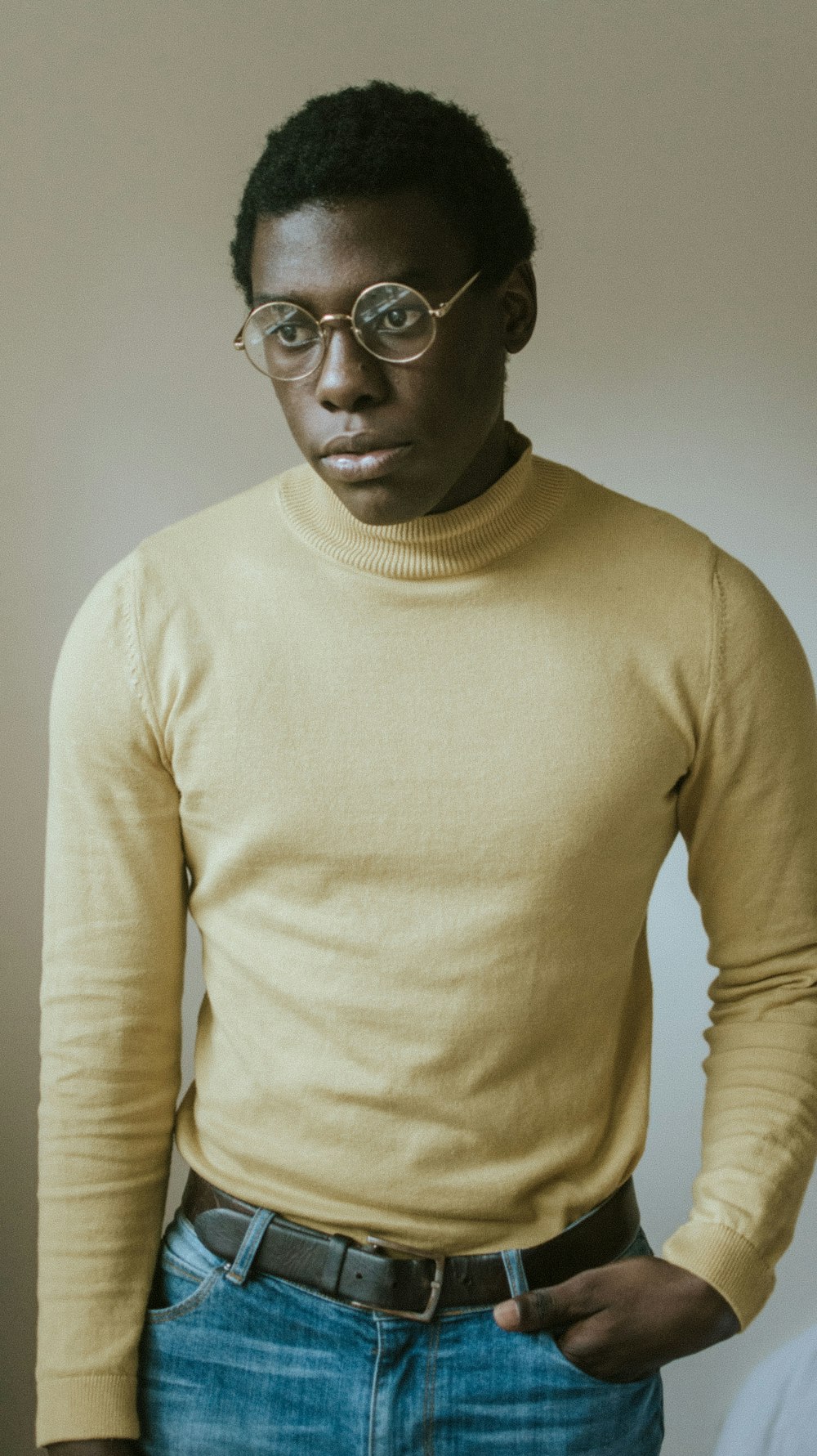 man wearing yellow sweater