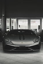 gray coupe on parking area