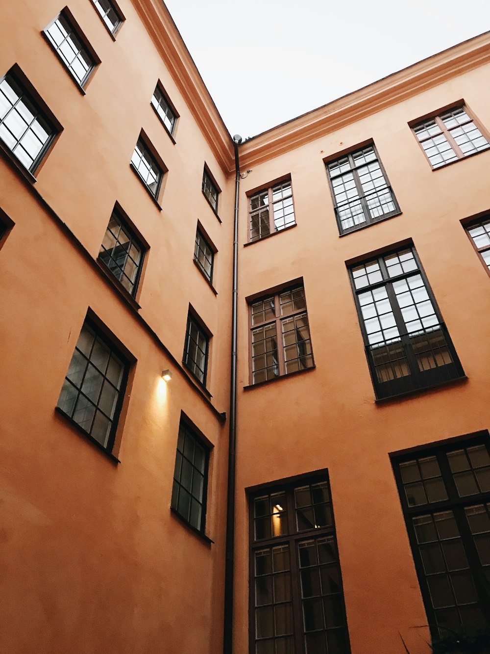 lowangle photography of orange concrete building