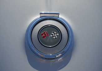 Stylized graphic of a championship belt merged with racing elements and metallic gray accents.