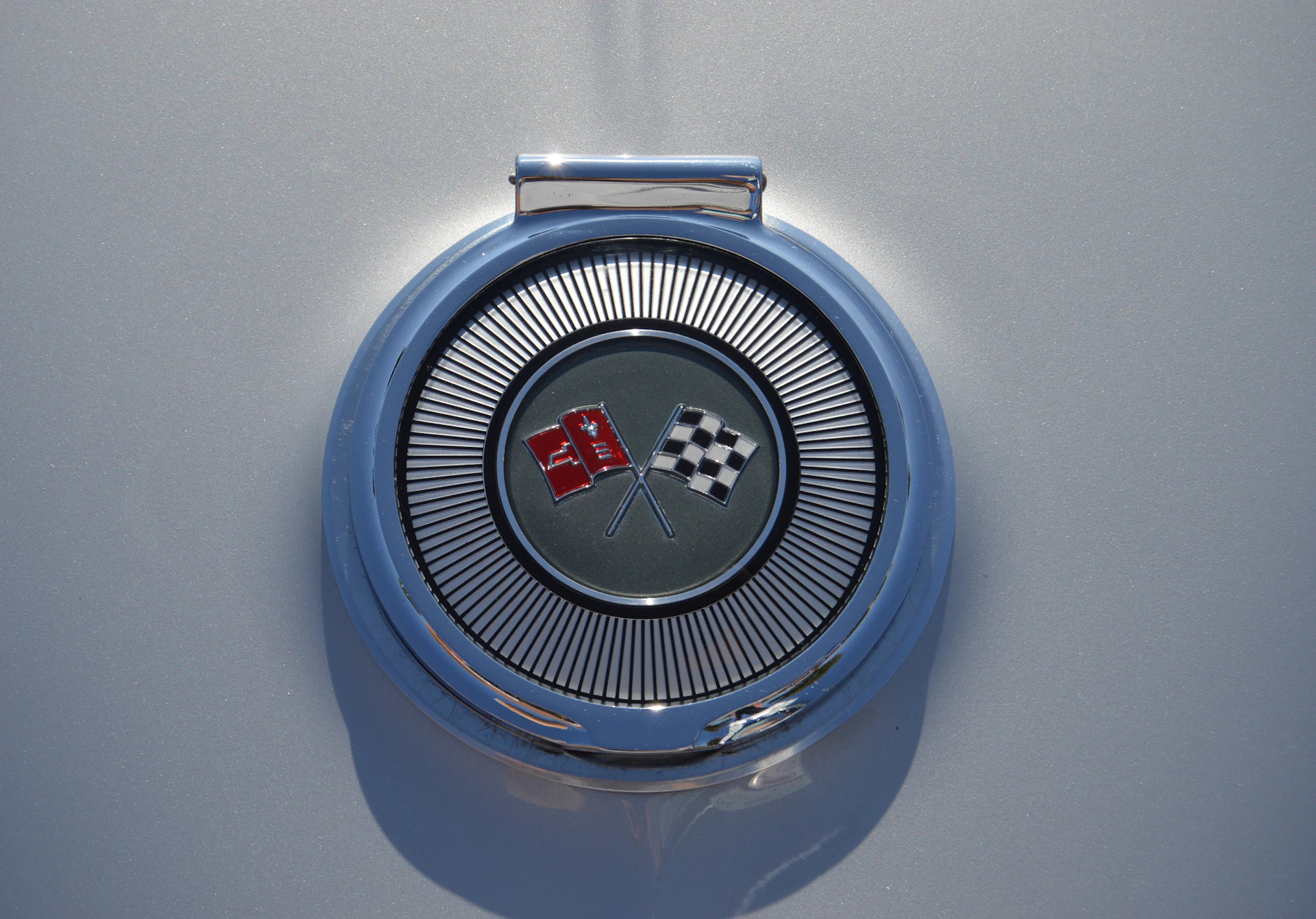 Placeholder circular emblem featuring a red and black striped pattern resembling a football team crest.