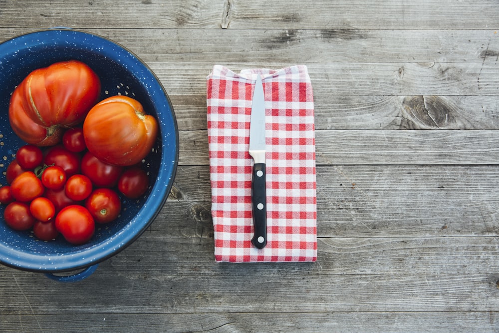 silver knife with black handle