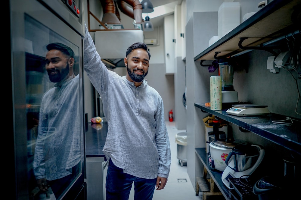 man standing in kitchen