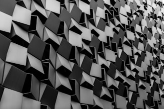 Abstract geometric shapes forming a sleek, modern pattern in cool tones representing innovation and clarity.